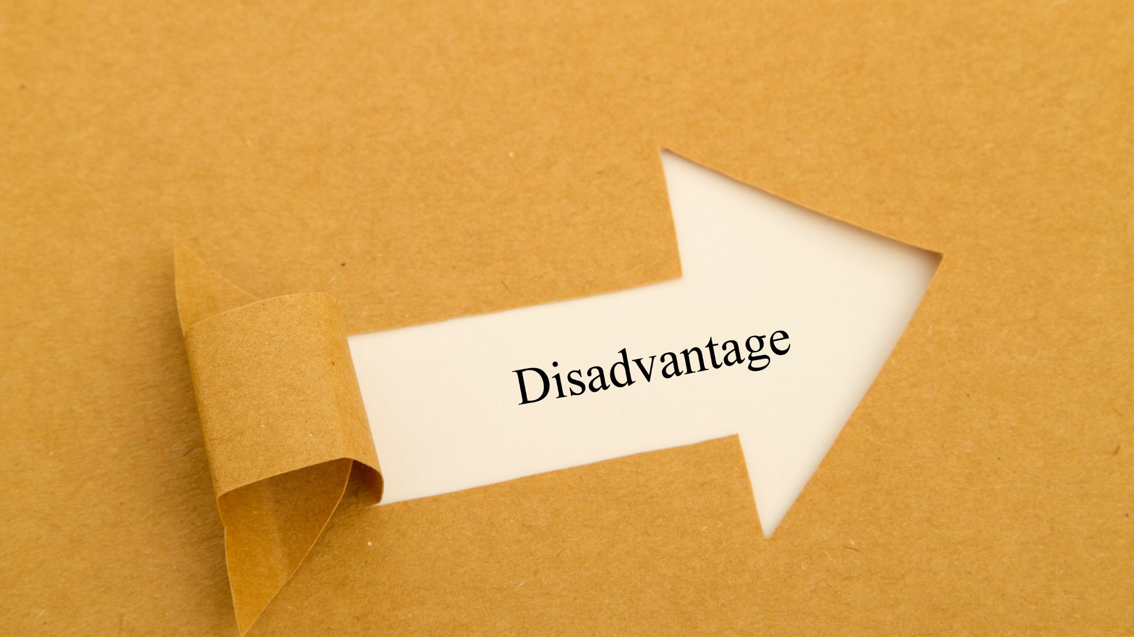 paper being torn with the word disadvantage under it